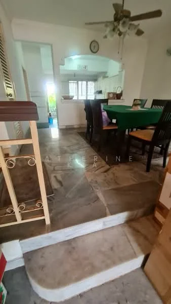 Dining features: marble flooring, ceiling fan, dining table with green tablecloth, wooden dining chairs, open layout to kitchen, natural light from windows, staircase leading to another level, wall with decorative railing.