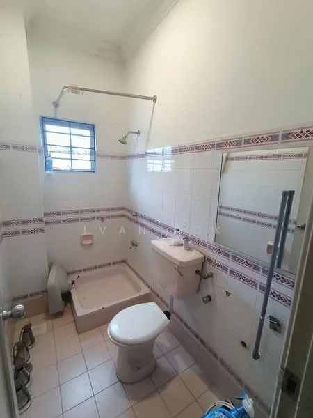 Bathroom features: white tiled walls, cream tiled flooring, shower area with showerhead, toilet, single-sink vanity, framed mirror, window for natural light, towel rack.