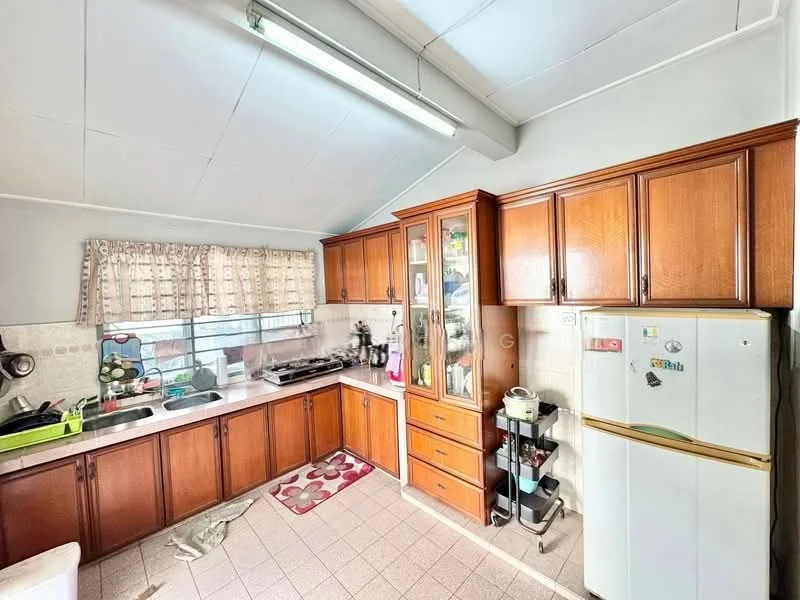 Kitchen features: L-shaped countertop, white ceramic tile backsplash, brown wooden cabinetry, glass-front upper cabinets, stainless-steel sink, chrome pull-down faucet, freestanding fridge, built-in gas stove, exhaust hood, window with sheer curtains, light grey tiled flooring, area rug with floral pattern, overhead fluorescent lighting; style: traditional.
