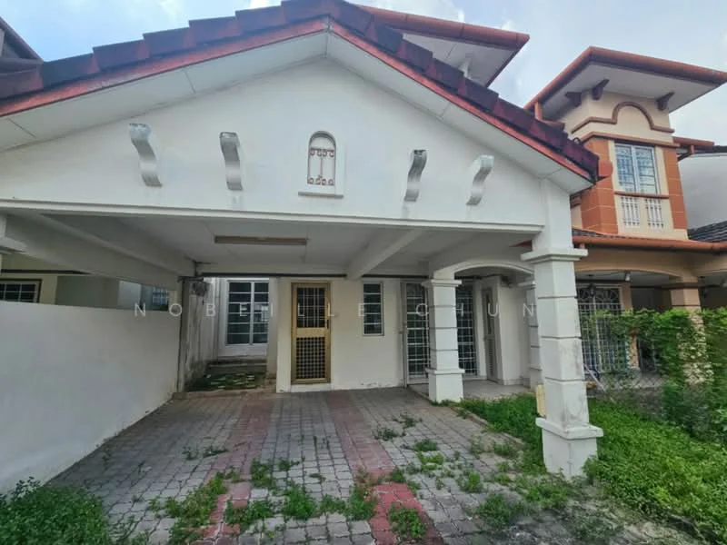 Exterior type: detached bungalow; features: white painted facade, red tiled roof, paved driveway, car porch with columns, front garden area with overgrown grass, two visible entrances with security grills, adjacent house visible, single-storey structure; style: modern.