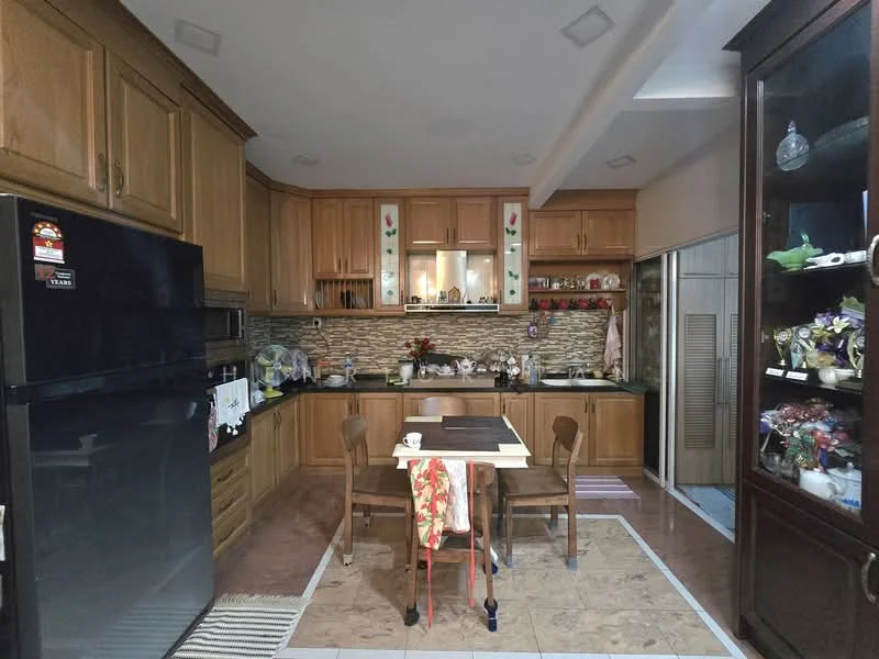 Kitchen features: wood cabinetry, black granite countertop, stainless-steel fridge, built-in oven, ceramic tile flooring, stone backsplash, kitchen island with seating, wall-mounted cabinets, decorative items on shelves, table with chairs, under-cabinet lighting; style: traditional.