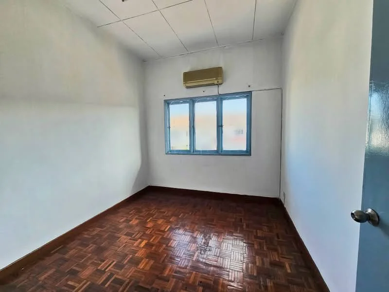 Room features: white painted walls, parquet wood flooring, 1 wall-mounted split AC, 2 windows with blue frames, ceiling tiles, no visible furniture or decor.