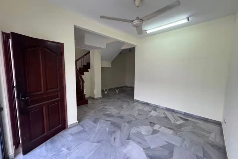 Room features: white painted walls, marble flooring, ceiling fan, staircase visible, door leading outside, fluorescent ceiling light.
