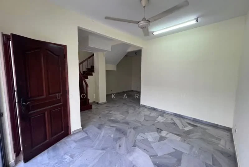 Room features: marble flooring, cream painted walls, ceiling fan, staircase visible in background, door leading outside, fluorescent ceiling light.