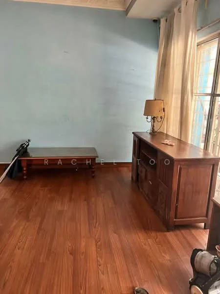 Room features: wooden flooring, light blue painted walls, wooden console table, wooden coffee table, table lamp, curtains, natural light from window.
