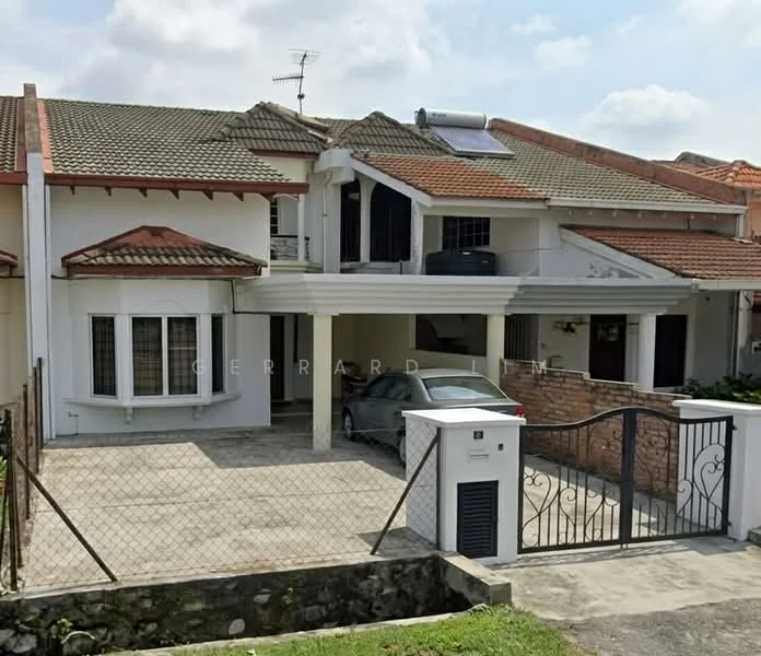 Exterior type: semi-detached house; features: red tiled roof, white painted facade, stone cladding on lower wall, covered car porch, fenced front yard, driveway with interlocking pavers, satellite dish on roof, solar water heater on roof, front gate with intercom, landscaped garden area; style: modern.