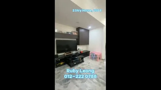 Living features: marble flooring, wall-mounted TV, dark wood TV console, light-colored walls, recessed downlights, small pink table, black storage cabinets, decorative items on shelves; style: modern.