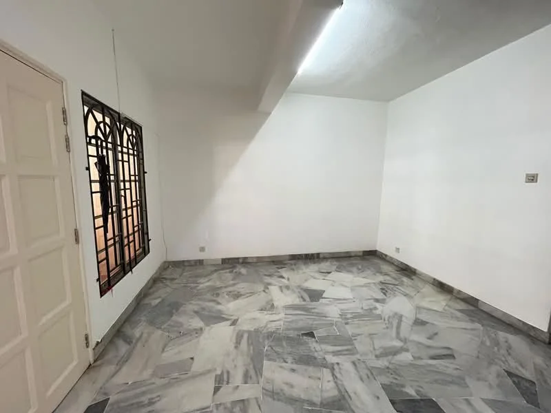 Room features: white painted walls, marble tile flooring, window with decorative grille, ceiling light fixture.