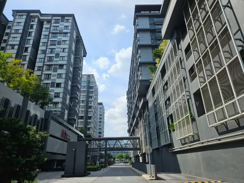 Exterior type: high-rise condominium; features: glass curtain wall, grey painted facade, recessed balconies, landscaped greenery, pedestrian walkway, covered walkway, multiple storeys, urban context with skyline view; style: modern.
