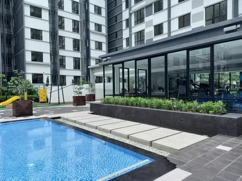 Exterior type: high-rise condominium; features: infinity pool, pool deck with loungers, glass facade gym, children's playground, manicured landscaping, concrete pavers, outdoor seating area, tropical plants; style: modern.