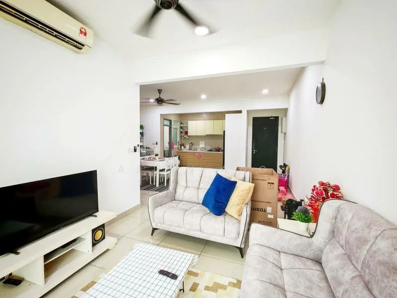 Living features: light grey fabric 3-seater sofa, light grey fabric 2-seater sofa, coffee table with grid pattern, wall-mounted TV, ceiling fan, wall-mounted air conditioning unit, decorative plants, boxes in background, white painted walls, tile flooring; style: modern. Kitchen features: open kitchen layout, white cabinetry, kitchen island, stainless-steel appliances, tile flooring; style: modern.
