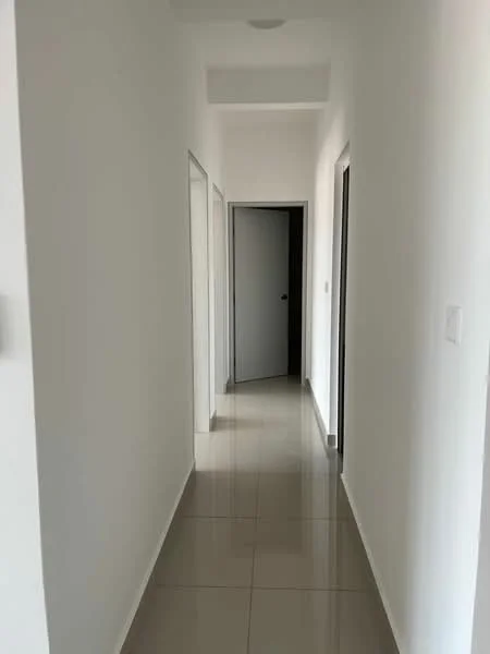 Hallway features: white painted walls, glossy ceramic tile flooring, recessed ceiling lights, two doors on the left, one door on the right, neutral color scheme, straight corridor layout; style: modern.