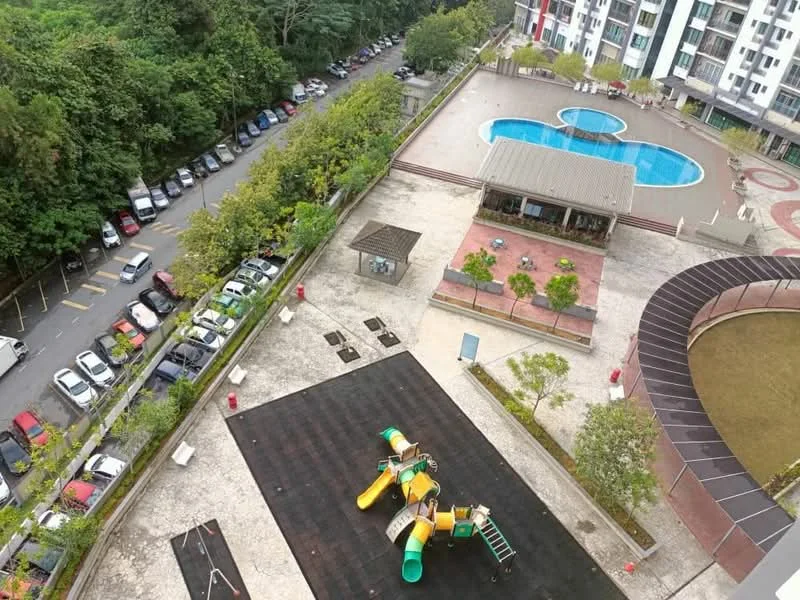 Exterior type: high-rise condominium; features: swimming pool, children's playground with slides and climbing structures, landscaped garden area, manicured lawn, outdoor seating area, parking lot with multiple vehicles, surrounded by greenery; style: modern.