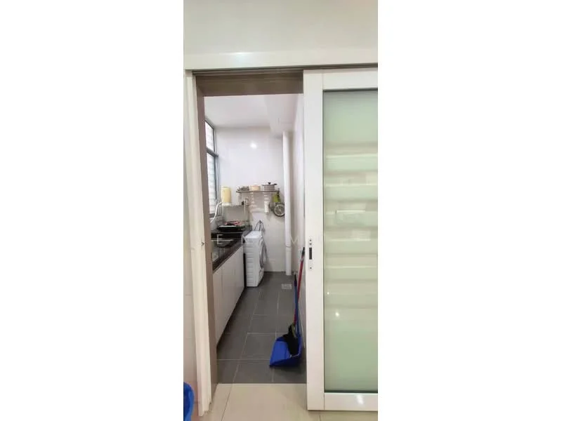 Kitchen features: white cabinetry, grey tile flooring, stainless-steel sink, built-in oven, freestanding washing machine, countertop with appliances, window with natural light, sliding glass door, kitchen utensils on countertop; style: modern.