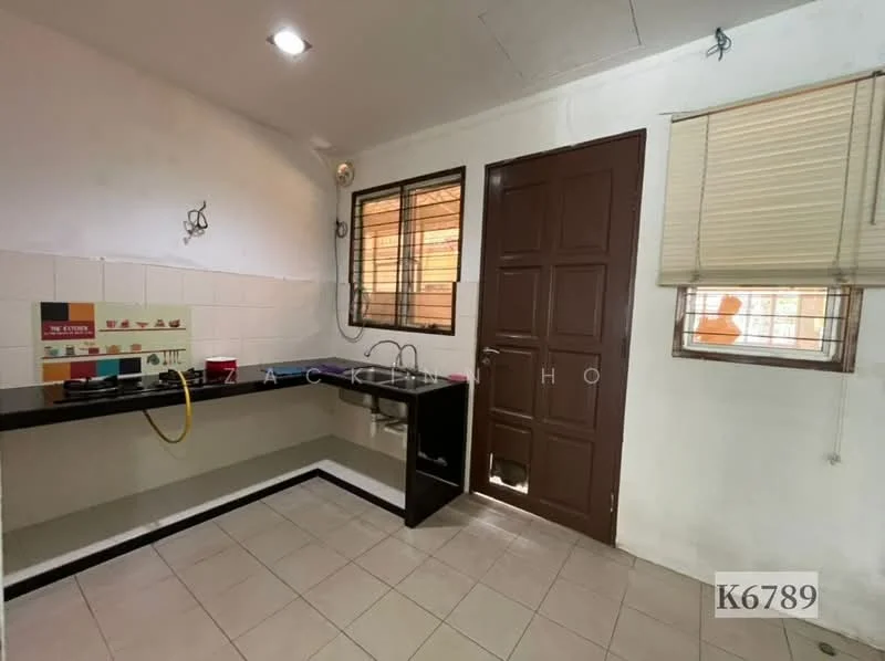 Kitchen features: black countertop, single-bowl stainless-steel sink, chrome pull-down faucet, white tiled backsplash, cream painted walls, tile flooring, window with blinds, door with panel design, kitchen cabinetry, wall-mounted light fixture.