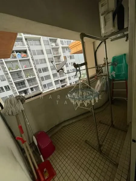 Room features: tiled flooring, clothes drying rack, mop, bucket, green storage container, satellite dish, balcony railing, city view, laundry area; view: city.