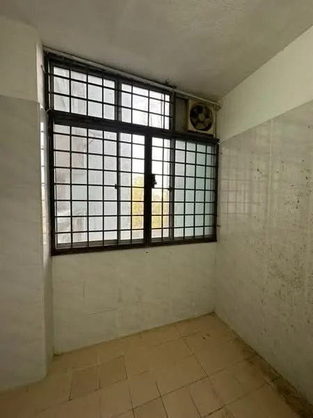 Room features: white painted walls, tile flooring, large window with metal grille, wall-mounted air conditioning unit, corner location, natural light from window.