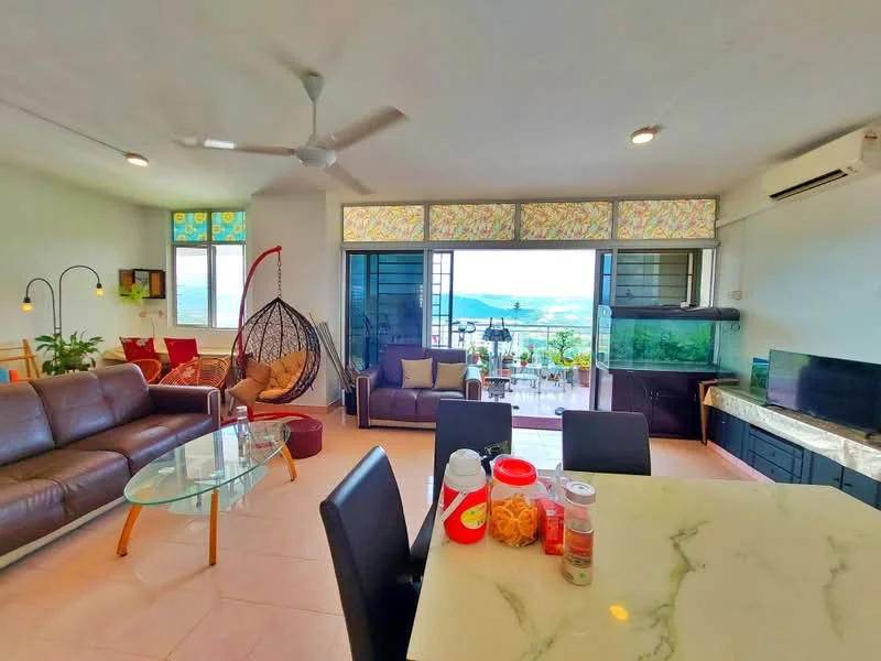 Living features: 3-seater leather sofa in brown, 2-seater leather sofa in brown, glass coffee table, hanging rattan chair, floor-to-ceiling windows, sliding glass door, wall-mounted TV, recessed downlights, ceiling fan, decorative plants, area rug, open layout to kitchen, view of outdoor terrace; style: modern; view: sea. Kitchen features: marble countertop, stainless-steel sink, kitchen cabinets, bar stools, refrigerator, microwave, kettle, storage jars; style: modern; view: sea.