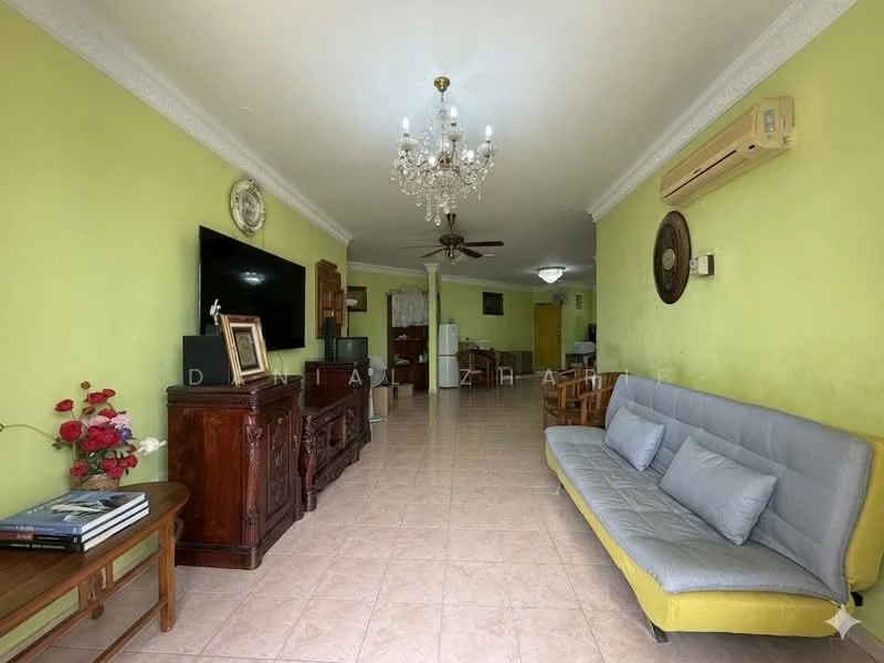 Living features: green painted walls, tiled flooring, chandelier, 5-blade ceiling fan, wall-mounted air conditioning unit, grey fabric sofa, yellow accent sofa, wooden coffee table, wooden sideboard, decorative wall clock, framed artwork, decorative plant; style: traditional.