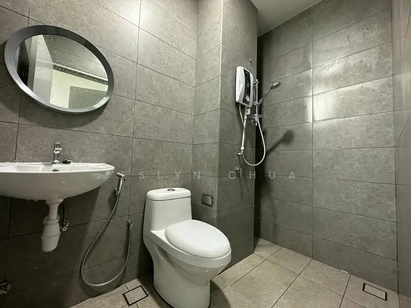 Bathroom features: grey tiled walls, grey tiled flooring, round mirror, wall-mounted shower head, handheld shower, chrome basin mixer faucet, one-piece toilet, bidet spray, wall-mounted hair dryer; style: modern.