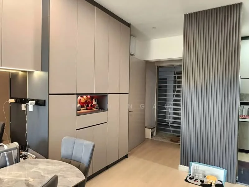 Room features: grey cabinetry, built-in storage, marble dining table, upholstered dining chairs, light wood flooring, recessed lighting, sliding door, decorative wall paneling; style: modern.