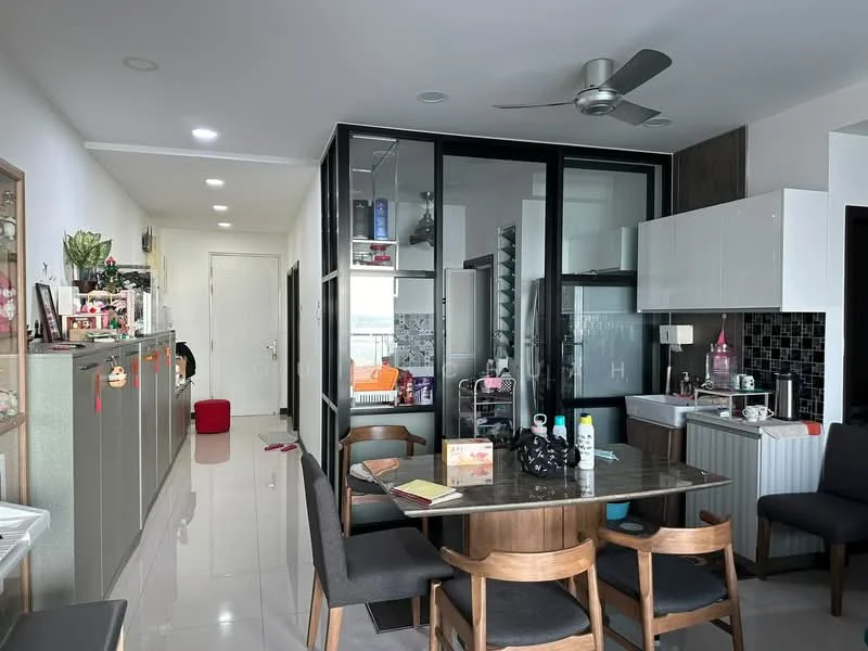 Dining features: dining table with four wooden chairs, ceiling fan, white walls, grey tiled flooring, open-plan layout, decorative wall with shelves, glass partition, kitchen area visible, black backsplash, kitchen cabinets, refrigerator visible, decorative items on shelves; style: modern. Kitchen features: white cabinets, black countertop, stainless-steel sink, built-in appliances, kitchen island, open shelving; style: modern. Hallway features: white walls, grey tiled flooring, doorway leading to another room.
