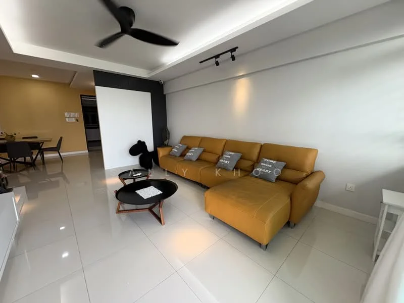 Living features: L-shape sectional sofa in mustard yellow, black coffee table, white decorative tray on coffee table, 5-blade ceiling fan, recessed downlights, white painted walls, glossy white tile flooring, decorative cushions on sofa; style: modern.
