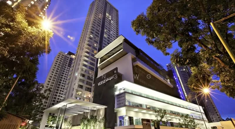 Exterior type: high-rise condominium; features: glass curtain wall, exposed concrete facade, recessed balconies, feature lighting at night, approximately 20-storey high-rise, manicured landscaping, surrounded by mature greenery, modern architectural design; style: modern.