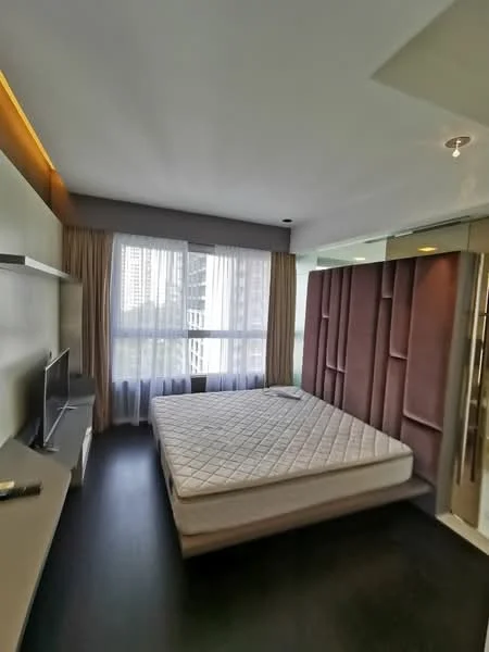 Bedroom features: queen-size bed with mattress, upholstered headboard, floor-to-ceiling windows, sheer curtains, wooden flooring, wall-mounted TV, built-in wardrobe, floating shelf, recessed lighting, decorative wall paneling; style: modern; view: city.
