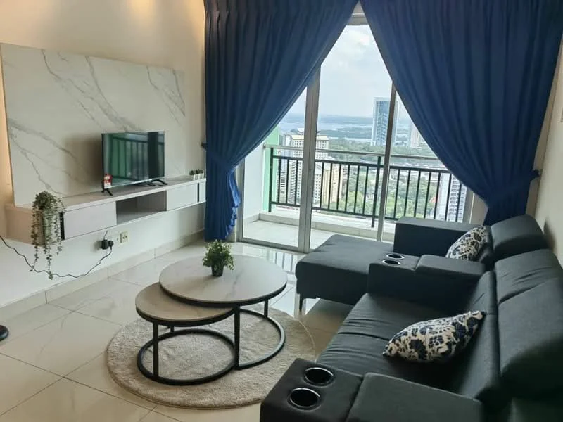 Living features: grey fabric sofa with cup holders, round coffee table with black metal base, wall-mounted TV, marble feature wall, floor-to-ceiling windows, blue curtains, ceramic tile flooring, decorative plants, city view from window; style: modern; view: city.