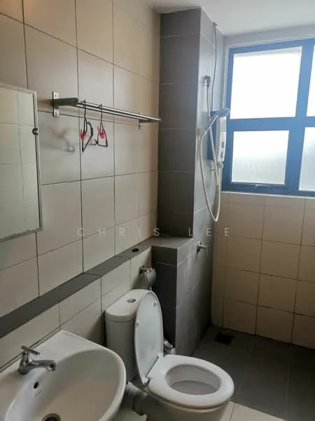Bathroom features: white ceramic toilet, single-sink vanity with chrome faucet, mirror above sink, shower with handheld showerhead, grey tile flooring, light grey wall tiles, dark grey accent wall, window with grid pattern, towel rack, soap dish; style: modern.