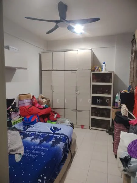 Bedroom features: single bed with blue bedding, built-in wardrobe with sliding doors, storage cabinets, ceiling fan, tile flooring, window with curtains, decorative wall shelf, various boxes and items stored, light fixture on ceiling.