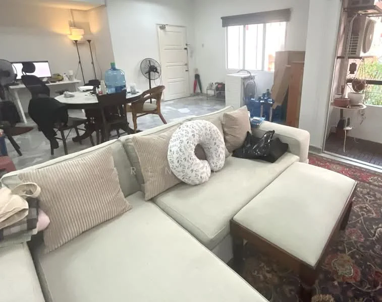 Living features: L-shape sectional sofa in cream, decorative throw pillows, wooden coffee table, area rug with intricate pattern, floor lamp, wall-mounted fan, window with white blinds, light grey walls, marble tile flooring, dining table with chairs in background, water dispenser, multiple fans visible; style: contemporary.