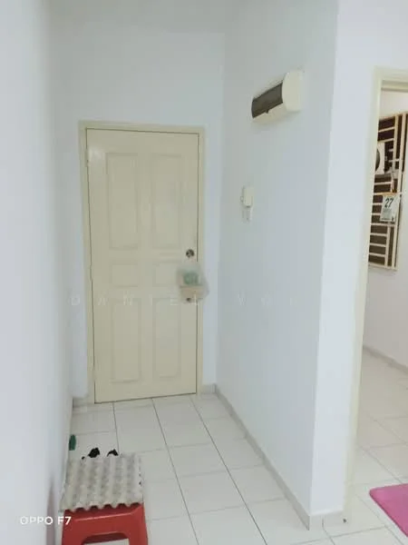 Room features: white painted walls, white tiled flooring, cream door, wall-mounted air conditioning unit, light switch, doorbell, small step stool, red plastic stool.