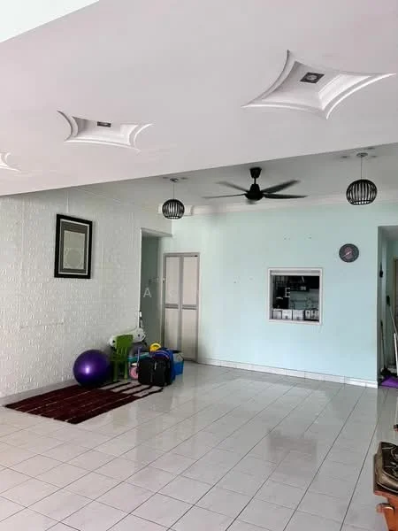 Living features: white painted walls, tray ceiling with decorative panels, 5-blade ceiling fan with light, recessed downlights, white tiled flooring, area rug with geometric pattern, wall clock, framed artwork, green chair, purple exercise ball, luggage, kitchenette visible in background; style: modern.