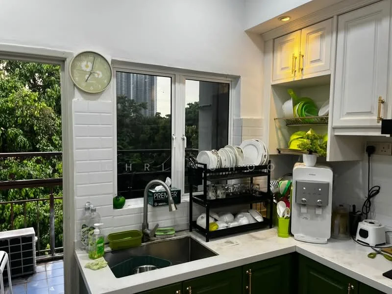 Kitchen features: green cabinetry, white tiled backsplash, marble countertop, single-bowl stainless-steel sink, chrome pull-down faucet, built-in refrigerator, microwave, kettle, dish rack with plates, clock on wall, window with view of greenery, floor tiles in blue, under-cabinet lighting; style: modern; view: garden.