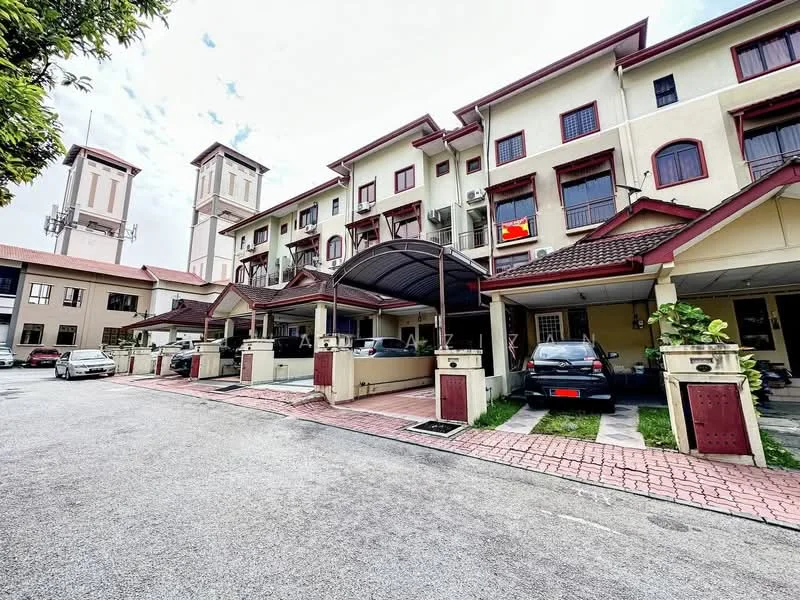 Exterior type: linked terrace house; features: two-storey building, red tiled roof, cream painted facade, covered car porch, brick-paved driveway, manicured landscaping, multiple parking spaces, balconies on upper floor, security post visible, surrounded by greenery; style: modern.