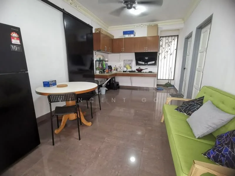 Kitchen features: green fabric sofa, round dining table, black dining chairs, black refrigerator, wooden cabinetry, black countertop, stainless-steel sink, built-in stove, wall-mounted kitchen hood, marble tile flooring, ceiling fan with light, window with grill, decorative wall panel; style: modern.