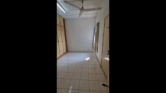 Room features: white painted walls, glossy ceramic tile flooring, ceiling fan, built-in wardrobes, window with natural light, door, light fixture.