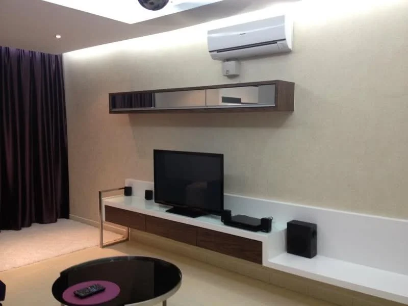 Living features: wall-mounted TV, wooden TV console, white floating shelf, black speaker, air conditioning unit, recessed ceiling lights, dark purple curtains, round coffee table with purple accent, light-colored flooring, textured wall finish; style: modern.