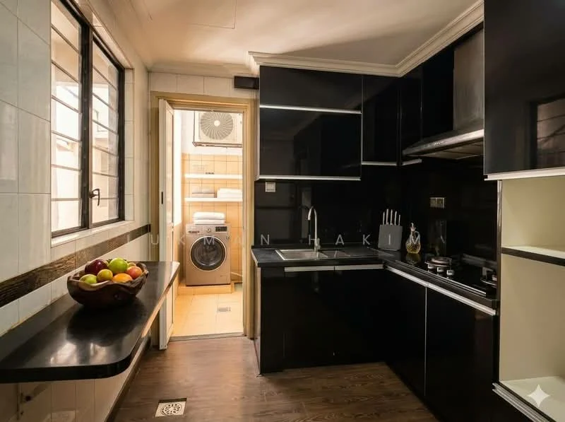Kitchen features: black cabinetry, stainless-steel sink, chrome pull-down faucet, black countertop, built-in gas hob, built-in oven, wall-mounted microwave, tile backsplash, wooden flooring, window with black frame, fruit bowl with assorted fruits, open shelving; style: modern. Laundry features: front-load washing machine, tile flooring, window with natural light.