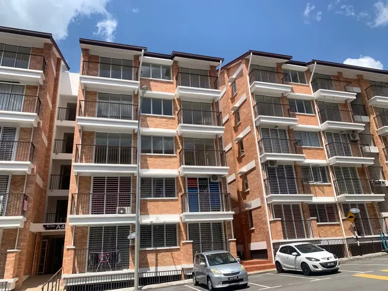 Exterior type: mid-rise condominium; features: red brick facade, balconies with railings, floor-to-ceiling windows, visible air conditioning units, multiple storeys, parking spaces in front; style: modern.