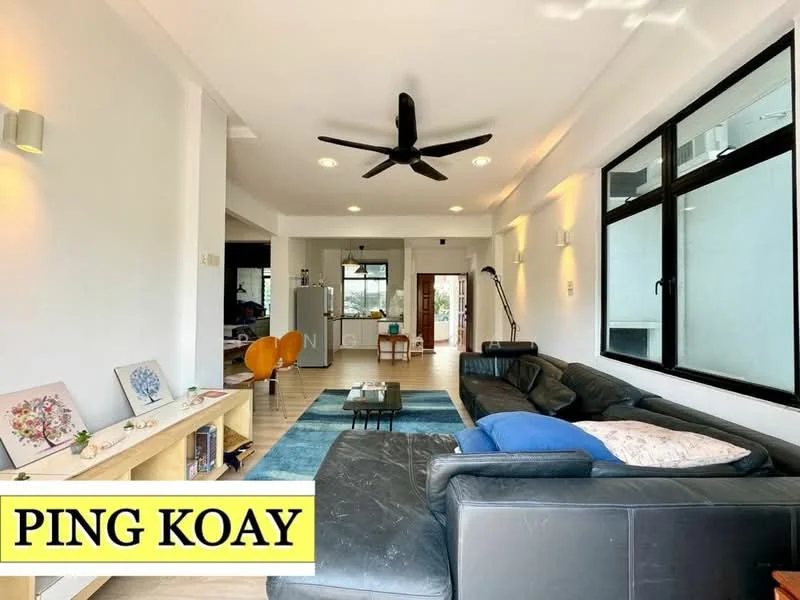 Living features: black leather sectional sofa, area rug with geometric pattern, 5-blade ceiling fan with light, wall-mounted lighting fixtures, large windows with black frames, wooden flooring, coffee table, decorative wall art, open layout to kitchen, natural light from windows; style: modern; view: garden.