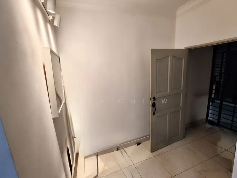 Room features: white painted walls, tile flooring, wooden door, door handle, light fixtures, corner wall, window with security bars.
