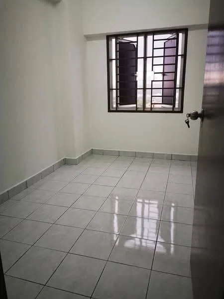 Room features: white painted walls, ceramic tile flooring, single window with metal grille, two open shutters, neutral color scheme, no visible furniture, corner room, natural light from window.