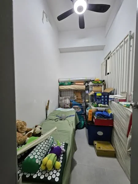 Room features: white painted walls, grey tiled flooring, 5-blade ceiling fan with light, storage boxes, bedding, stuffed toys, rolled-up mats, wire storage rack.