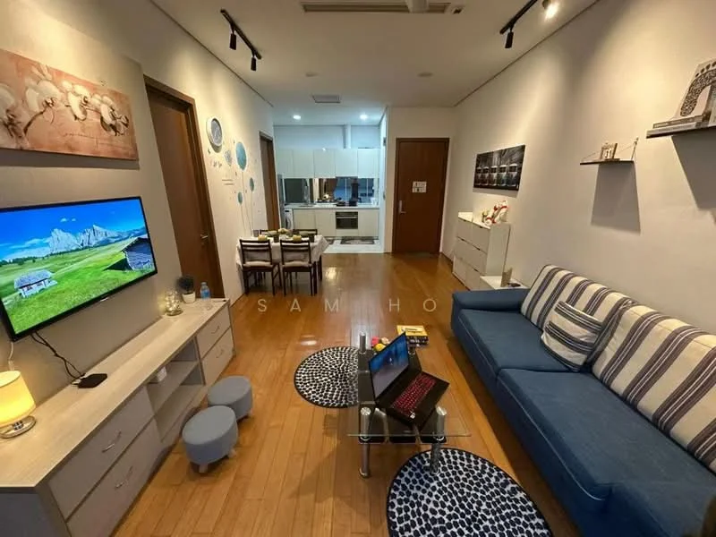 Living features: blue fabric sofa, coffee table, wall-mounted TV, TV console, wooden flooring, white painted walls, decorative wall art, dining table with chairs, recessed lighting, decorative shelves, area rug with geometric pattern, small ottoman, laptop on table; style: modern.