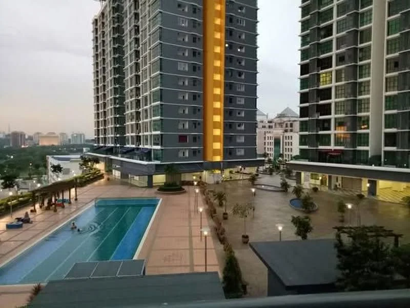 Exterior type: high-rise condominium; features: swimming pool, lap pool, pool deck with loungers, landscaped garden area, outdoor lighting, seating areas, manicured landscaping, multiple storeys, balconies on upper floors; style: modern.