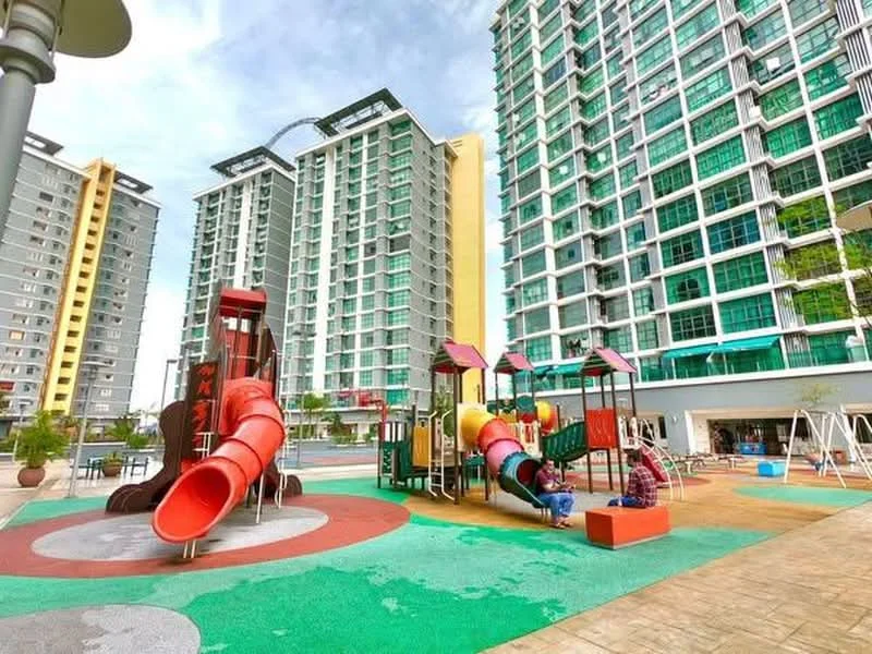 Exterior type: high-rise condominium; features: children's playground with slides, swing set, manicured landscaping, paved walkways, multiple high-rise buildings, green lawn area, outdoor seating area, modern architectural design; style: modern.