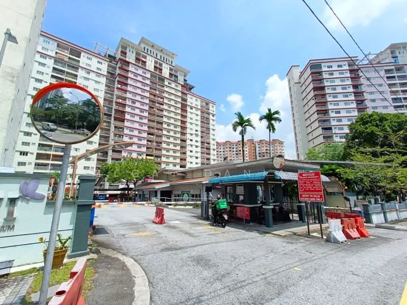 Exterior type: high-rise condominium; features: multiple high-rise buildings, guard house at entrance, manicured landscaping, paved driveway, traffic barriers, surrounding palm trees, signage at entrance, mirrored traffic mirror; style: modern.